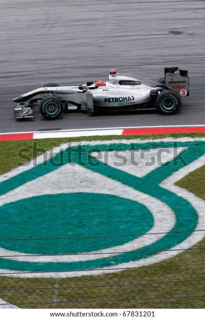 KUALA LUMPUR - APRIL 3: Mercedes\' driver\
Michael Schumacher drives by his team\'s sponsor logo during the\
2010 Petronas Malaysia Grand-Prix on April 3, 2010 in Sepang\
International Circuit,\
Malaysia.