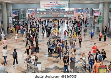 KUALA LUMPUR - AUG 6, 2017: Commuters in KL Sentral transportation hub in Brickfields, KL. KL Sentral is Malaysia largest intermodal transportation hub. - Shutterstock ID 691367005
