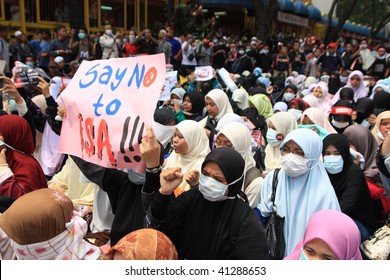 KUALA LUMPUR - AUGUST 1: Jane Doe of Kuala Lumpur showing a sign, "Say no to ISA!!!", at the anti-ISA (Internal Security Act) protest in August 1, 2009, in Kuala Lumpur, Malaysia. - Shutterstock ID 41288653