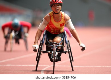 KUALA LUMPUR - AUGUST 15: Vietnam's Wheel Chair Athlete Wins The 800m Race At The Track And Field Event Of The Fifth ASEAN Para Games On August 15, 2009 In Kuala Lumpur.