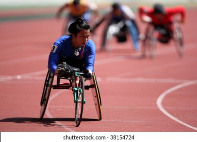 KUALA LUMPUR - AUGUST 16: Thailand's Wheel Chair Athlete Wins The 800m Race At The Track And Field Event Of The Fifth ASEAN Para Games On August 16, 2009 In Kuala Lumpur.