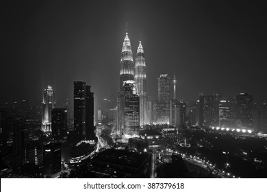 KUALA LUMPUR - AUGUST 25, 2015 - Majestic View Of Petronas Twin Towers At Night In Black And White. Petronas Twin Towers Also Known As KLCC Is The Tallest Building In Malaysia.