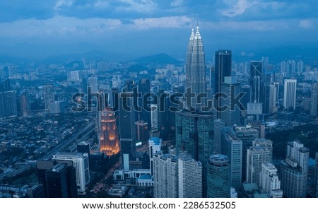 Kuala Lumpur City Skyscrapers view after sunset with Petronas towers in view.