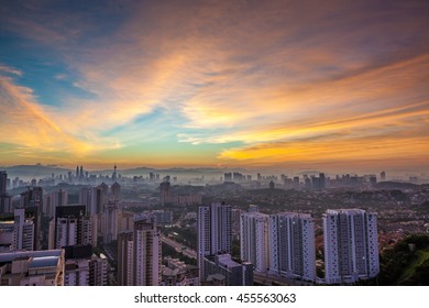 Kuala Lumpur cityscape at dawn with colorful cloudy sky, viewed from Mont Kiara, east of KL - Powered by Shutterstock