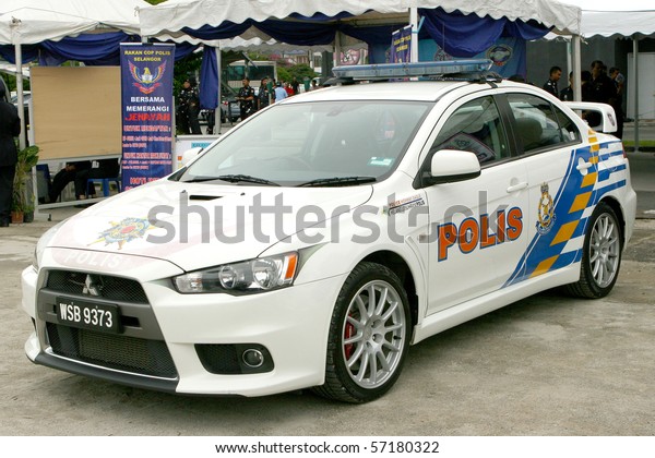 KUALA LUMPUR - JULY 3 : The Royal\
Malaysian Police Mitsubishi Lancer Evolution cars on display during\
a crime prevention campaign July 3, 2010 in Kuala\
Lumpur