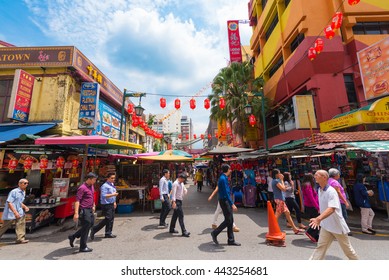 KUALA LUMPUR - JUNE 15, 2016: A lot of people walk in Chinatown, commonly known as Petaling Street. There are lots of budget hotels and cheap food in this neighborhood.