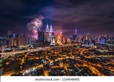 Kuala Lumpur Landscape With Klcc And Kampung Baru Along With Fireworks At The Background On Independence Day