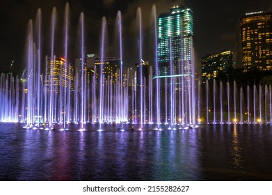 KUALA LUMPUR, MALAYSIA - 03 FEBRUARY, 2020: Colorful dancing fountain in KLCC Park in Kuala Lumpur, the capital city of Malaysia