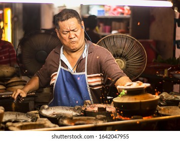 Kuala Lumpur, Malaysia - 05/02/2020: A Hawker Chef In The Famous Petaling Street, Kuala Lumpur