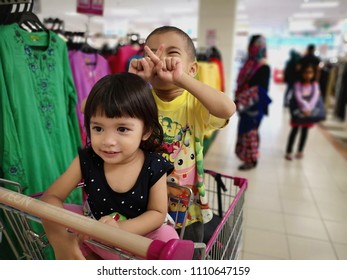 Kuala Lumpur, Malaysia, 10 Jun 2018: Happy Kids In Trolley Going To Shopping For Hari Raya Preparation, At Jusco Wangsa Maju Malaysia.