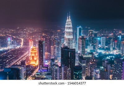 Kuala Lumpur, Malaysia: 10/30/19 - Skyline View Of The Petronas Towers And Downtown Kuala Lumpur At Night From The Menara KL Tower Sky Deck.