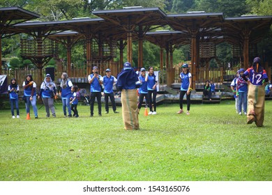 Kuala Lumpur, Malaysia - 28 October, 2019: Company Family Day. Adult And Kids Enjoy Playing With Gunny Sack Named Gunny Sack Race Sport.