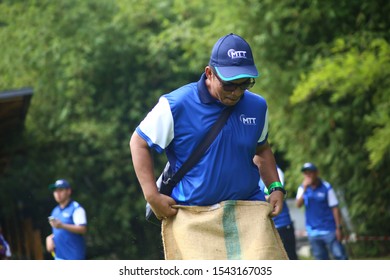 Kuala Lumpur, Malaysia - 28 October, 2019: Company Family Day. Adult And Kids Enjoy Playing With Gunny Sack Named Gunny Sack Race Sport.