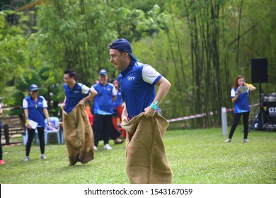 Kuala Lumpur, Malaysia - 28 October, 2019: Company Family Day. Adult And Kids Enjoy Playing With Gunny Sack Named Gunny Sack Race Sport.