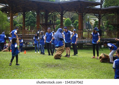 Kuala Lumpur, Malaysia - 28 October, 2019: Company Family Day. Adult And Kids Enjoy Playing With Gunny Sack Named Gunny Sack Race Sport.