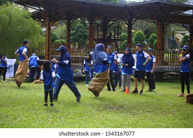 Kuala Lumpur, Malaysia - 28 October, 2019: Company Family Day. Adult And Kids Enjoy Playing With Gunny Sack Named Gunny Sack Race Sport.