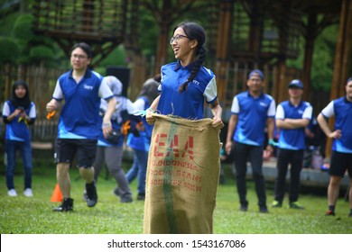 Kuala Lumpur, Malaysia - 28 October, 2019: Company Family Day. Adult And Kids Enjoy Playing With Gunny Sack Named Gunny Sack Race Sport.