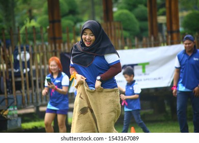 Kuala Lumpur, Malaysia - 28 October, 2019: Company Family Day. Adult And Kids Enjoy Playing With Gunny Sack Named Gunny Sack Race Sport.