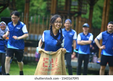 Kuala Lumpur, Malaysia - 28 October, 2019: Company Family Day. Adult And Kids Enjoy Playing With Gunny Sack Named Gunny Sack Race Sport.