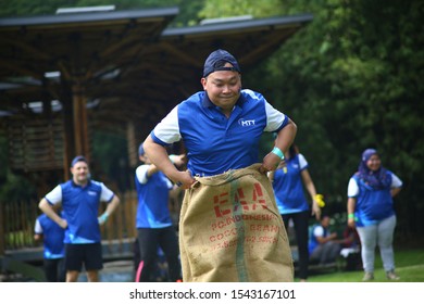 Kuala Lumpur, Malaysia - 28 October, 2019: Company Family Day. Adult And Kids Enjoy Playing With Gunny Sack Named Gunny Sack Race Sport.