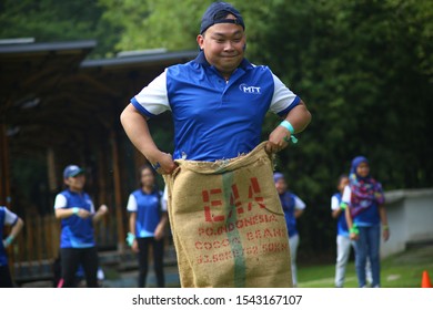 Kuala Lumpur, Malaysia - 28 October, 2019: Company Family Day. Adult And Kids Enjoy Playing With Gunny Sack Named Gunny Sack Race Sport.