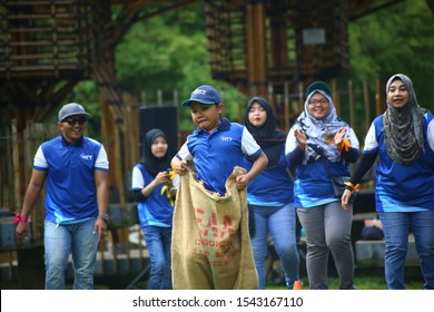 Kuala Lumpur, Malaysia - 28 October, 2019: Company Family Day. Adult And Kids Enjoy Playing With Gunny Sack Named Gunny Sack Race Sport.