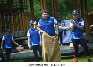 Kuala Lumpur, Malaysia - 28 October, 2019: Company Family Day. Adult And Kids Enjoy Playing With Gunny Sack Named Gunny Sack Race Sport.