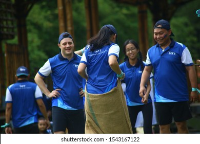 Kuala Lumpur, Malaysia - 28 October, 2019: Company Family Day. Adult And Kids Enjoy Playing With Gunny Sack Named Gunny Sack Race Sport.