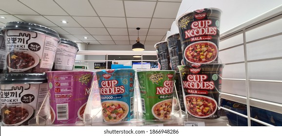 KUALA LUMPUR, MALAYSIA - 3 Dec 2020 : Various brand imported Korean and Japan instant noodles cup on display at Family mart convenience store shelf.