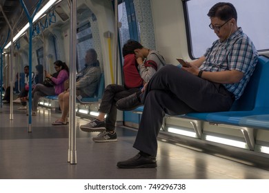 KUALA LUMPUR, MALAYSIA 3 NOVEMBER 2017 : Commuters on Mass Rapid Transit (MRT) train. MRT is the latest public transportation system. MRT is a transportation for future generation. - Shutterstock ID 749296738