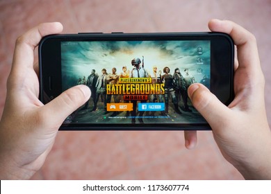 Kuala Lumpur, Malaysia - 7 September 2018: Hand holding a smartphone with Player's Unknown Battleground also known as PUBG online shooting gaming