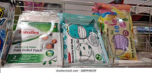 KUALA LUMPUR, MALAYSIA - 8 JANUARY 2021: Panadol Pain Relief Patch, Yuka Zan Protective Medical Face Mask Antibacterial Kids Face Mask Packs Selling At Family Mart Convenience Store Rack Display. 