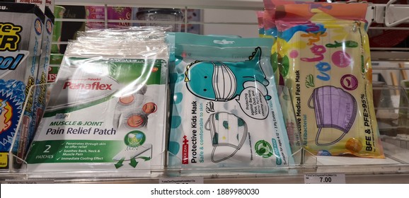 KUALA LUMPUR, MALAYSIA - 8 JANUARY 2021: Panadol Pain Relief Patch, Yuka Zan Protective Medical Face Mask Antibacterial Kids Face Mask Packs Selling At Family Mart Convenience Store Rack Display. 