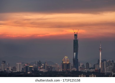 Kuala Lumpur, Malaysia - April 12 2020: Sunset View Of Kuala Lumpur New Icon Tower PNB118 Under Construction At Stadium Merdeka Area And Old Kuala Lumpur Jail Jalan Pudu