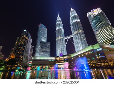 KUALA LUMPUR, MALAYSIA - APRIL 15: Night scene of Petronas Twin towers Suria KLCC fountain at Kuala Lumper, Malaysia on April 15,2015