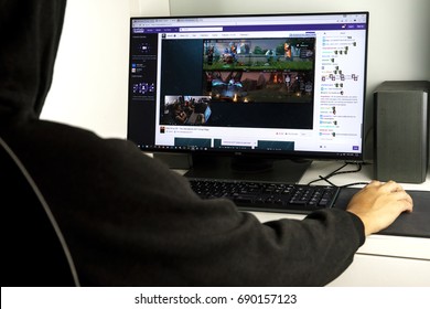 KUALA LUMPUR, MALAYSIA - AUG 4TH, 2017:  Unidentified man watching Dota 2 match on Twitch.tv. Twitch is a live streaming video platform owned by Twitch Interactive, a subsidiary of Amazon.com.