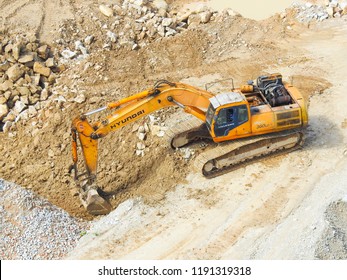 Kuala  Lumpur, Malaysia - August 12,2018 : Close up  of industrial excavator working on construction site. Selective focus and crop fragment