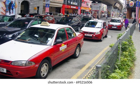 KUALA LUMPUR, MALAYSIA, AUGUST 13, 2017 : Taxi By The Road Side Waiting For Passenger In Jalan Tun Perak, Kuala Lumpur. Masjid Jamek LRT Station.