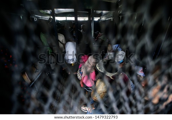 Kuala Lumpur, Malaysia - August 15, 2019 : Illegal\
foreign workers are arrested by Malaysia Immigration Department\
during raid in Kuala\
Lumpur