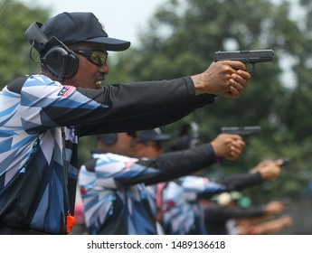 KUALA LUMPUR, MALAYSIA - AUGUST 24, 2019 : Law enforcements training shooting using Glock 19 pistol handgun at shooting training centre.