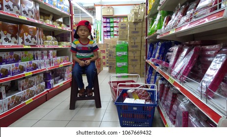 KUALA LUMPUR, MALAYSIA - CIRCA 2018: Portrait Of Handsome Male Asian Student With Deference Expression Face At Supermarket In Kuala Lumpur, Malaysia. Blurr  