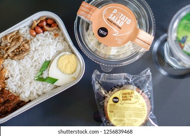 Kuala Lumpur, Malaysia - Circa December, 2018: The AirAsia Inflight Meal, Nasi Lemak Pak Naseer By AirAsia Santan. Selected Focus