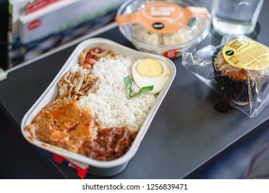 Kuala Lumpur, Malaysia - Circa December, 2018: The AirAsia Inflight Meal, Nasi Lemak Pak Naseer By AirAsia Santan. Selected Focus