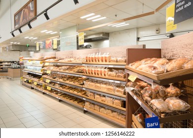 KUALA LUMPUR, MALAYSIA - Dec 8, 2018 : Assorted type of cake, bread and bun on shelf rack display in the Tesco store.