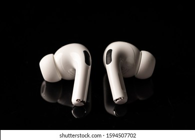 Kuala Lumpur, Malaysia - December 2019. Apple Airpods Pro isolated against black. The new airpods pro features active noise cancelling and  customizable fit