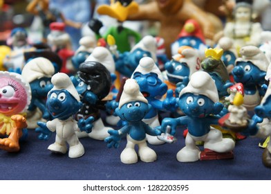 KUALA LUMPUR, MALAYSIA -DECEMBER 9, 2018:  Selective Focused Of Fictional Cartoon Action Figure Smurfs In Miniature Model Displayed For The Public On A Desk. 