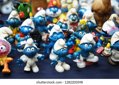 KUALA LUMPUR, MALAYSIA -DECEMBER 9, 2018:  Selective Focused Of Fictional Cartoon Action Figure Smurfs In Miniature Model Displayed For The Public On A Desk. 