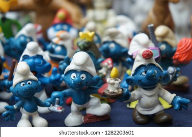 KUALA LUMPUR, MALAYSIA -DECEMBER 9, 2018:  Selective Focused Of Fictional Cartoon Action Figure Smurfs In Miniature Model Displayed For The Public On A Desk. 