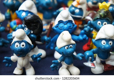 KUALA LUMPUR, MALAYSIA -DECEMBER 9, 2018:  Selective Focused Of Fictional Cartoon Action Figure Smurfs In Miniature Model Displayed For The Public On A Desk. 