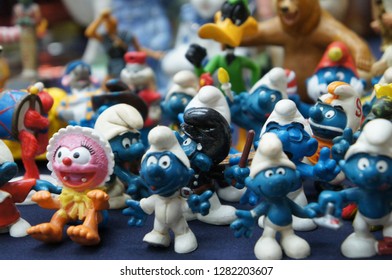 KUALA LUMPUR, MALAYSIA -DECEMBER 9, 2018:  Selective Focused Of Fictional Cartoon Action Figure Smurfs In Miniature Model Displayed For The Public On A Desk. 